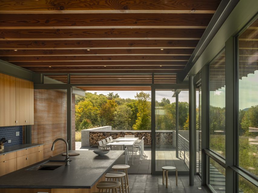 Kitchen and outdoor gathering areas at Gallatin Residence.